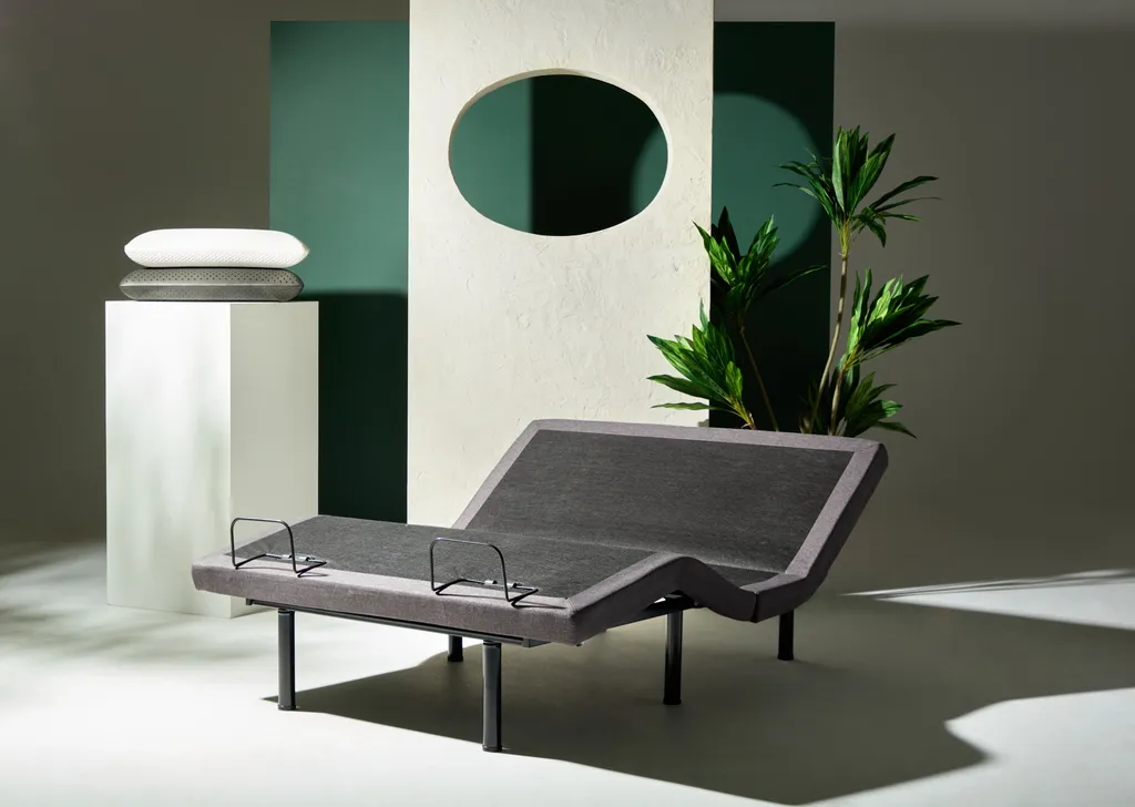 Adjustable mattress base around architecture and a tree