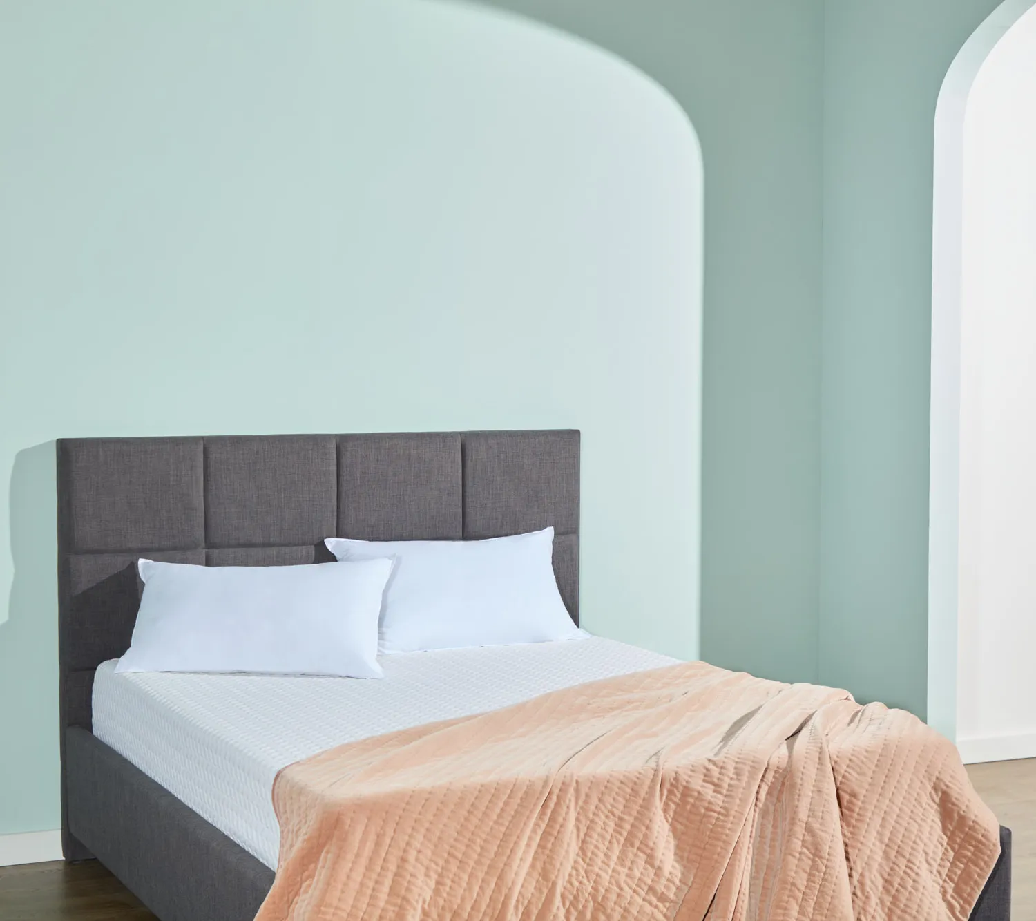 Simple bed with a mattress and bedding