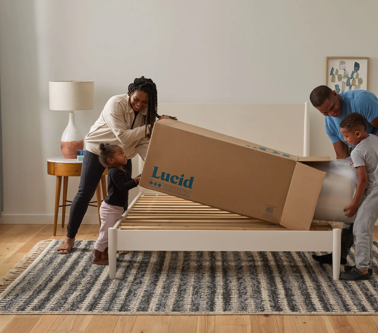 Family unboxing a mattress
